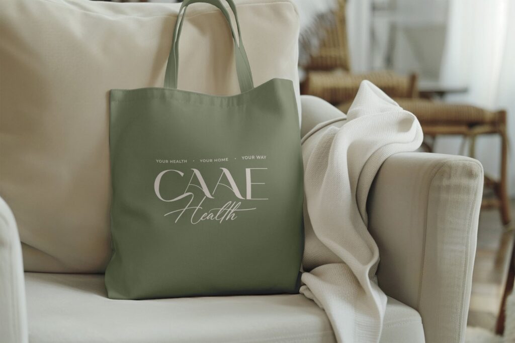 CAAE Health tote bag on a sofa